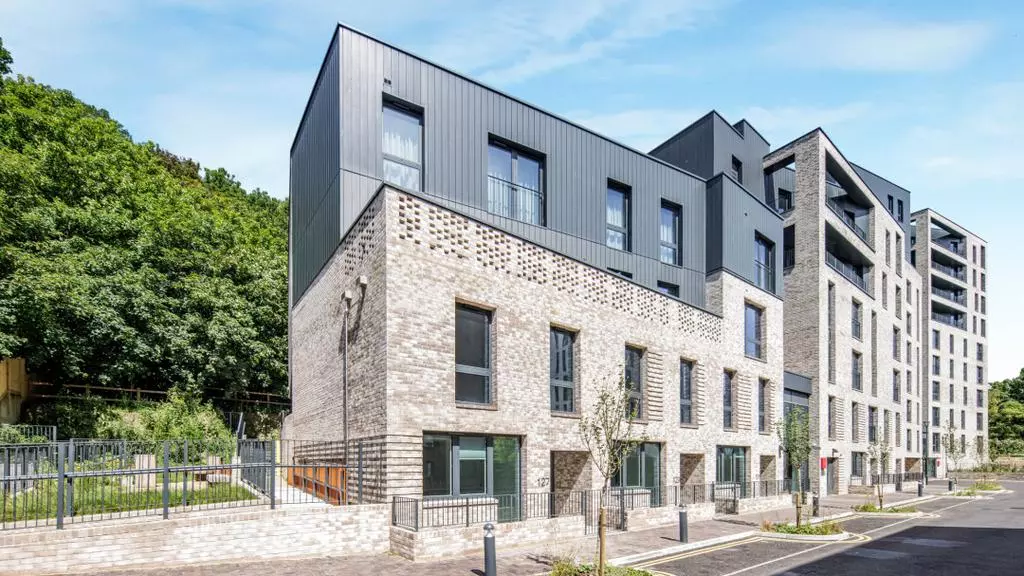 Modern brick apartment development beside trees